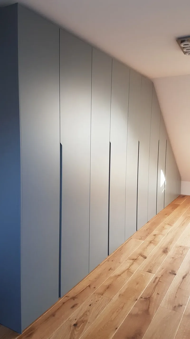 Slopping roof wardrobe - Herne, Germany - RAL7046 matte lacquered with integrated handles