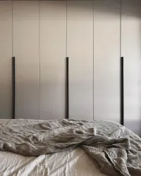 Customized wardrobe: this wardrobe is installed in our client’s bedroom in Karlsfeld, Germany, and is matte lacquered in FB 229 Elephants Breath with handle 33 RAL8019 matte lacquered.

The exact measurements of this wardrobe are 277 cm in width, 262 cm in height, and 61 cm in depth.